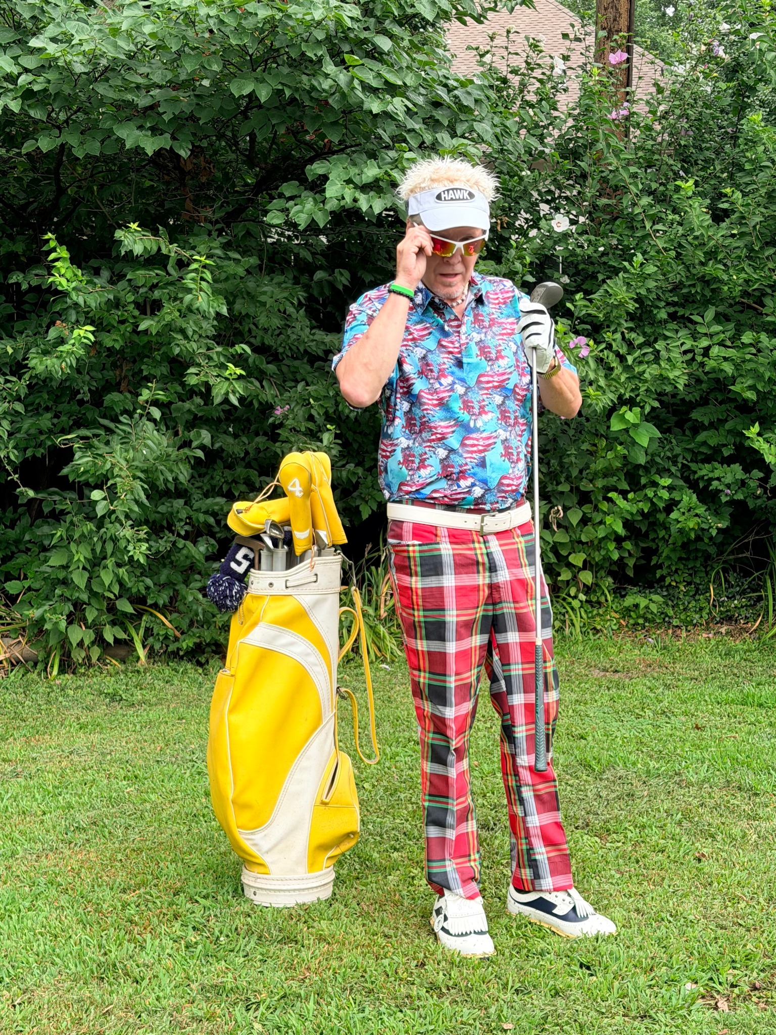 Will Ferrell golf character impersonator adjusting his sunglasses