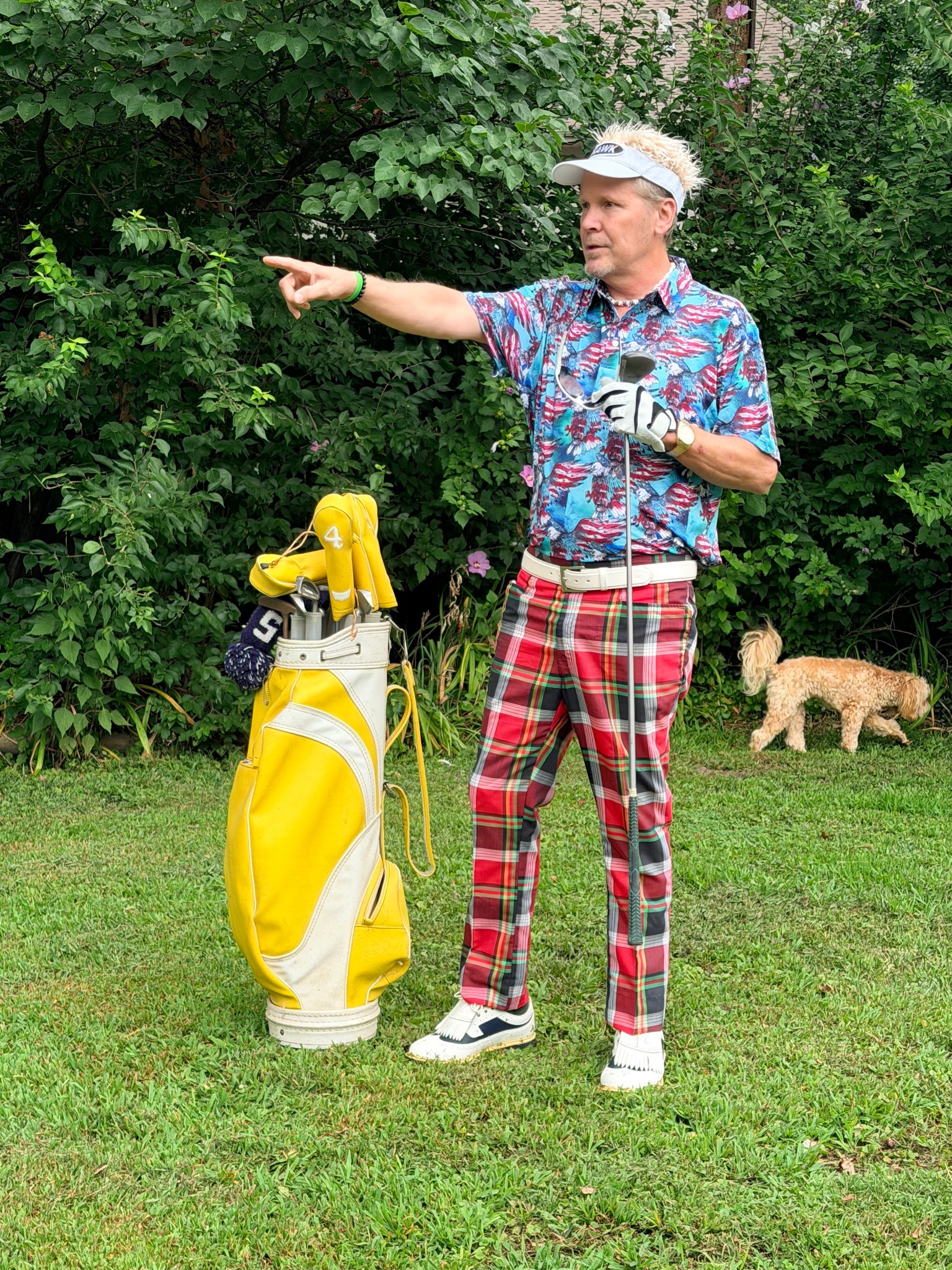 Lonnie The Hawk impersonator pointing on a golf course